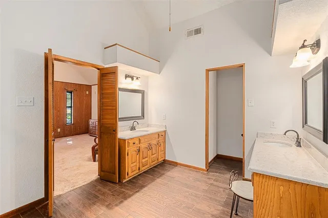 a en suite bathroom with a sink and a mirror