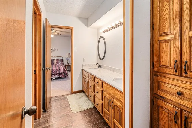 a bathroom with a double vanity sink and a mirror