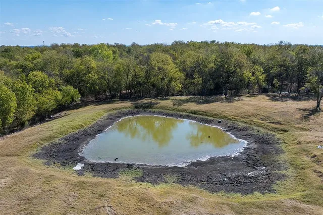 a view of a swimming pool with a yard