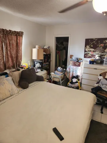 a bed room with furniture and a window