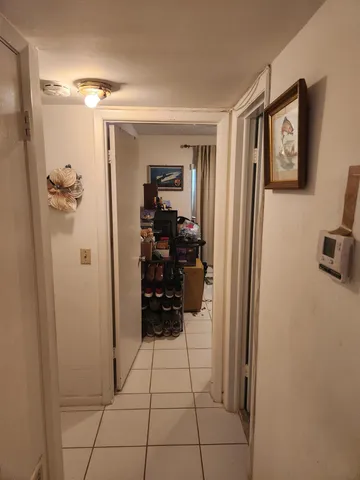 a view of a livingroom with walk in closet and bathroom