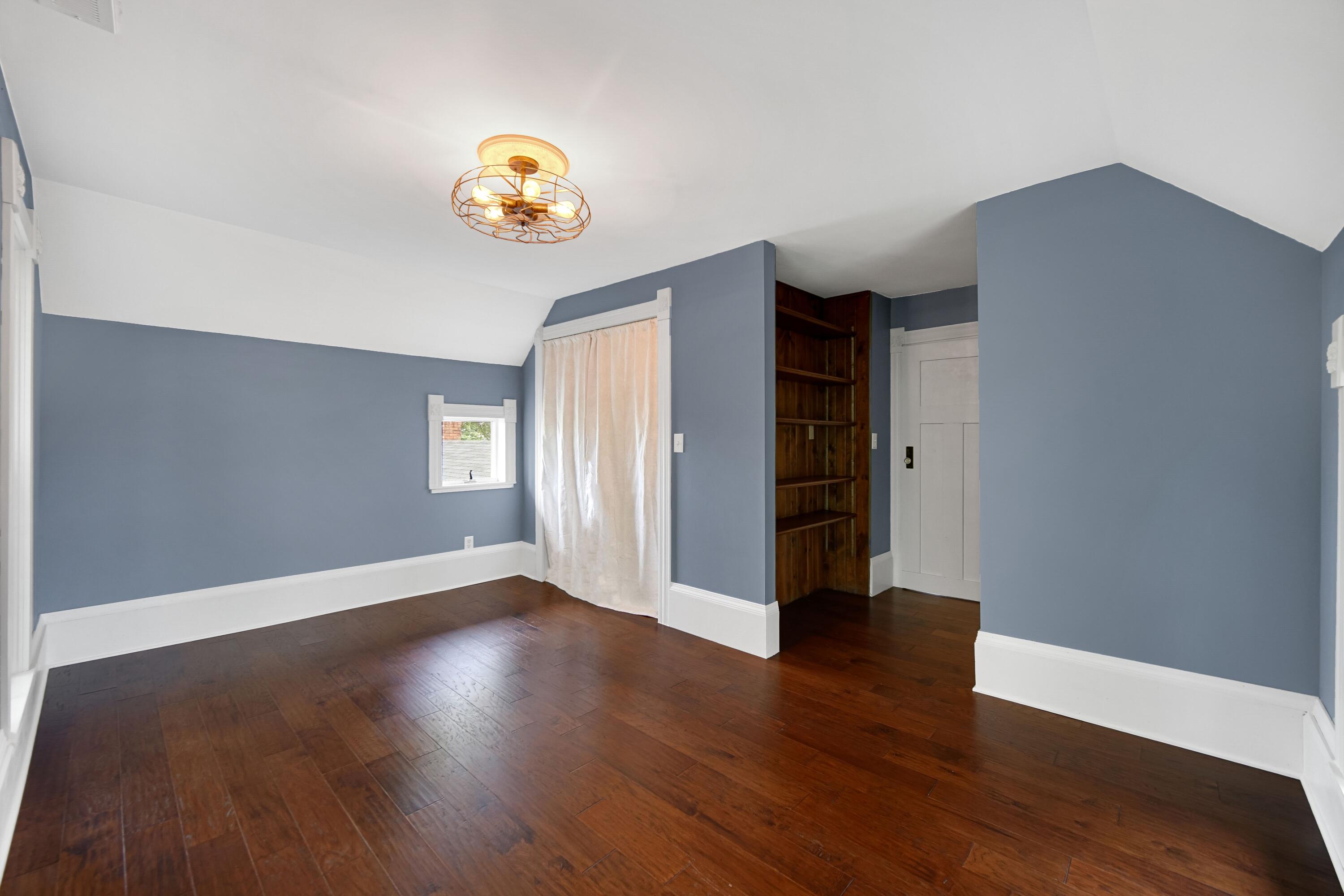 476 Highway 2 Hebron, IN 46341 - Photo 19 of 25 a view of an empty room with window and wooden floor