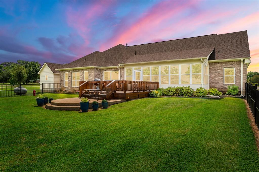 345 Rains County Road 3390 Emory, TX 75440 - Photo 2 of 39 a front view of a house with a garden and yard