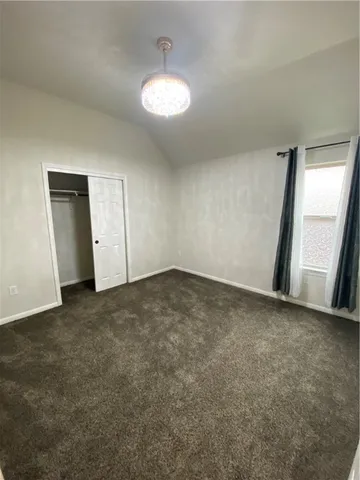 an empty room with a empty space and a sink