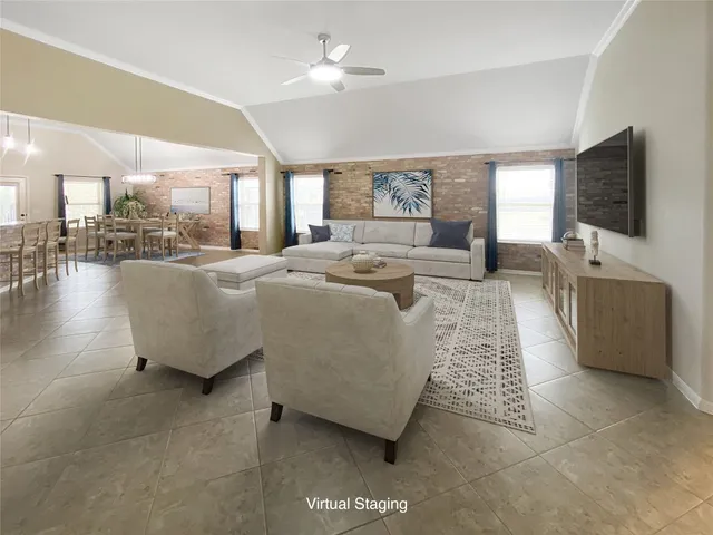 a living room with furniture and a flat screen tv