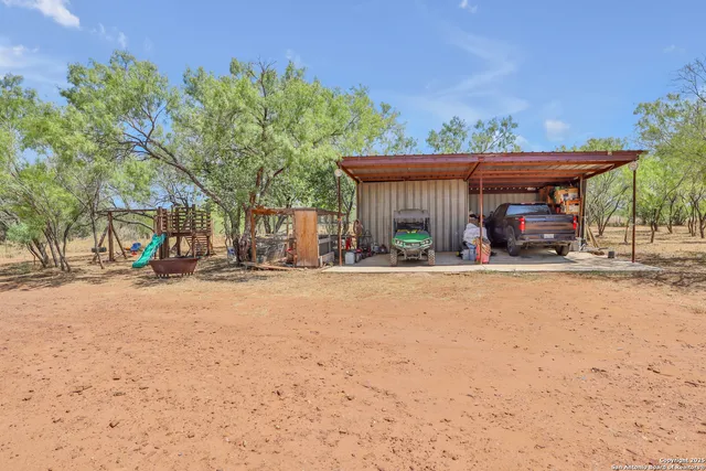 a wooden bench sitting in front of a building