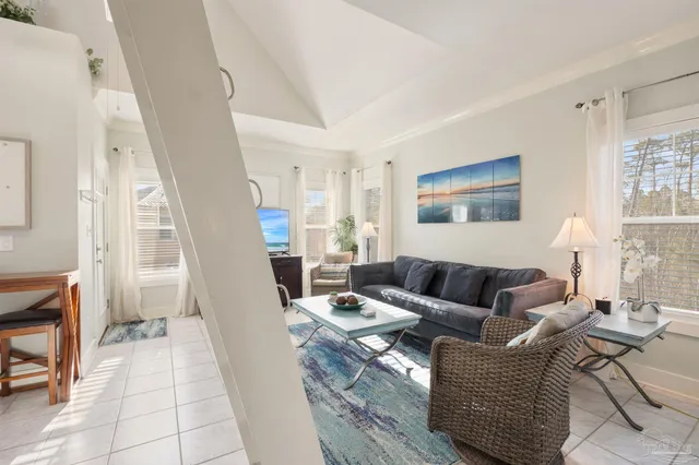 a kitchen with stainless steel appliances white cabinets and a refrigerator
