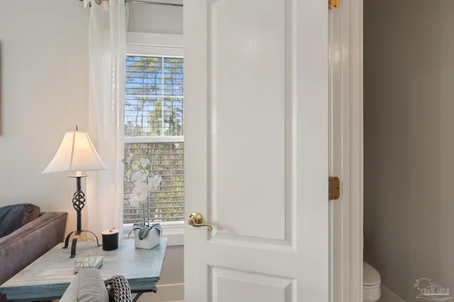 a front view of house with yard and trees around