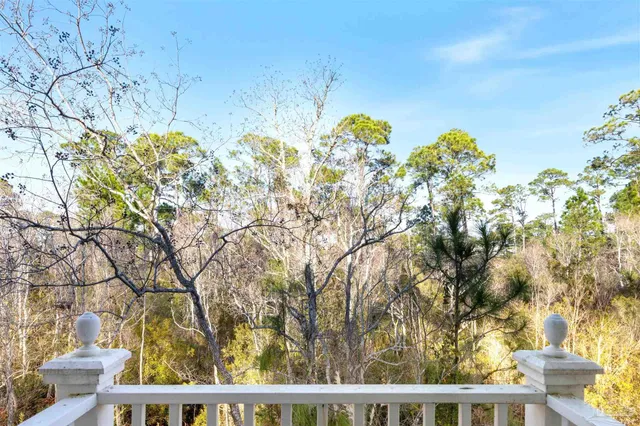a view of a living room and kitchen