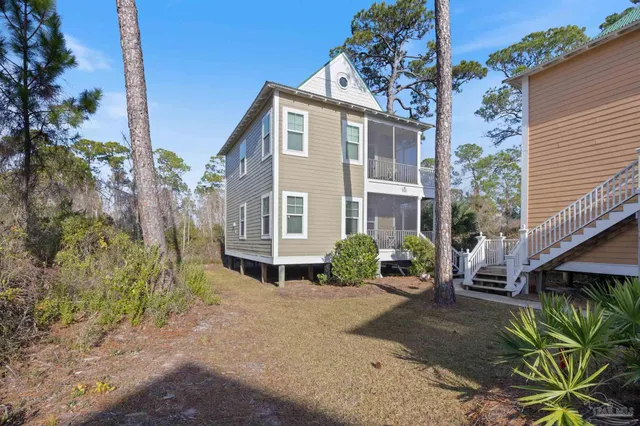 a view of a living room with furniture and a window