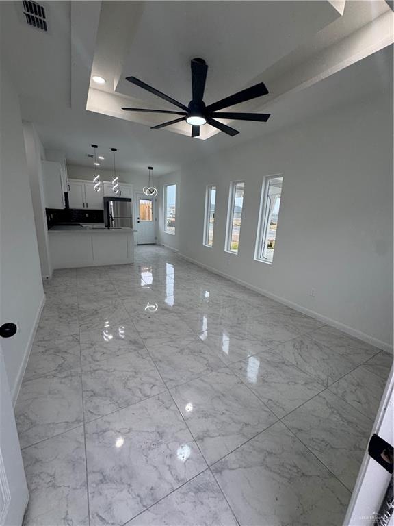 5804 Notre Dame Avenue, Unit 1 Mission, TX 78573 - Photo 2 of 12 a view of a livingroom with furniture and a ceiling fan