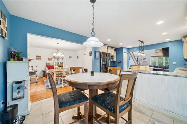 a very nice looking dining room with a table and chairs
