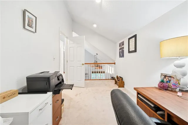 a bedroom with a bed and a workspace