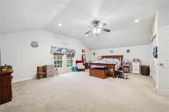 a view of a livingroom with furniture and a flat screen tv
