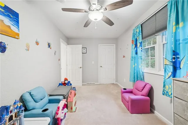 a bedroom with furniture and a chandelier
