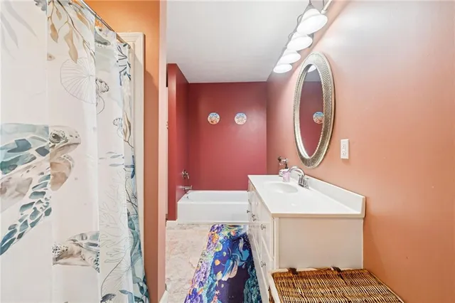 a bathroom with a sink and a mirror