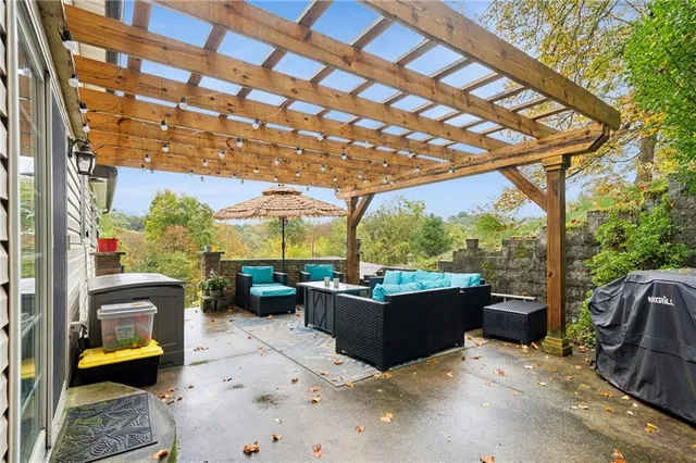 a view of patio with couches and chairs