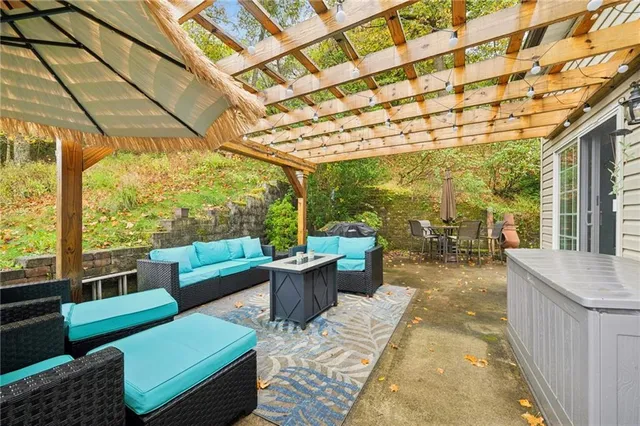 a view of a patio with couches and potted plants