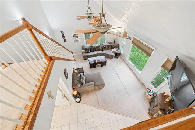 a view of living room with furniture and kitchen view
