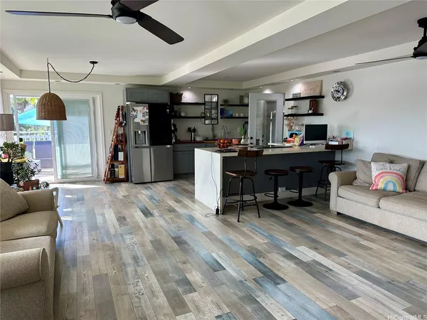 a living room with furniture and a piano