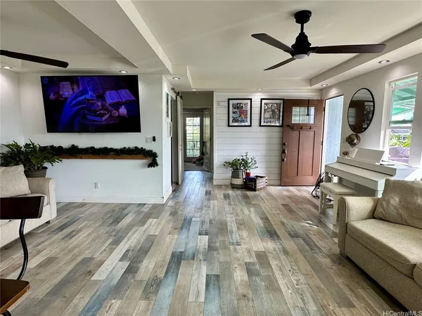 a living room with furniture and a flat screen tv