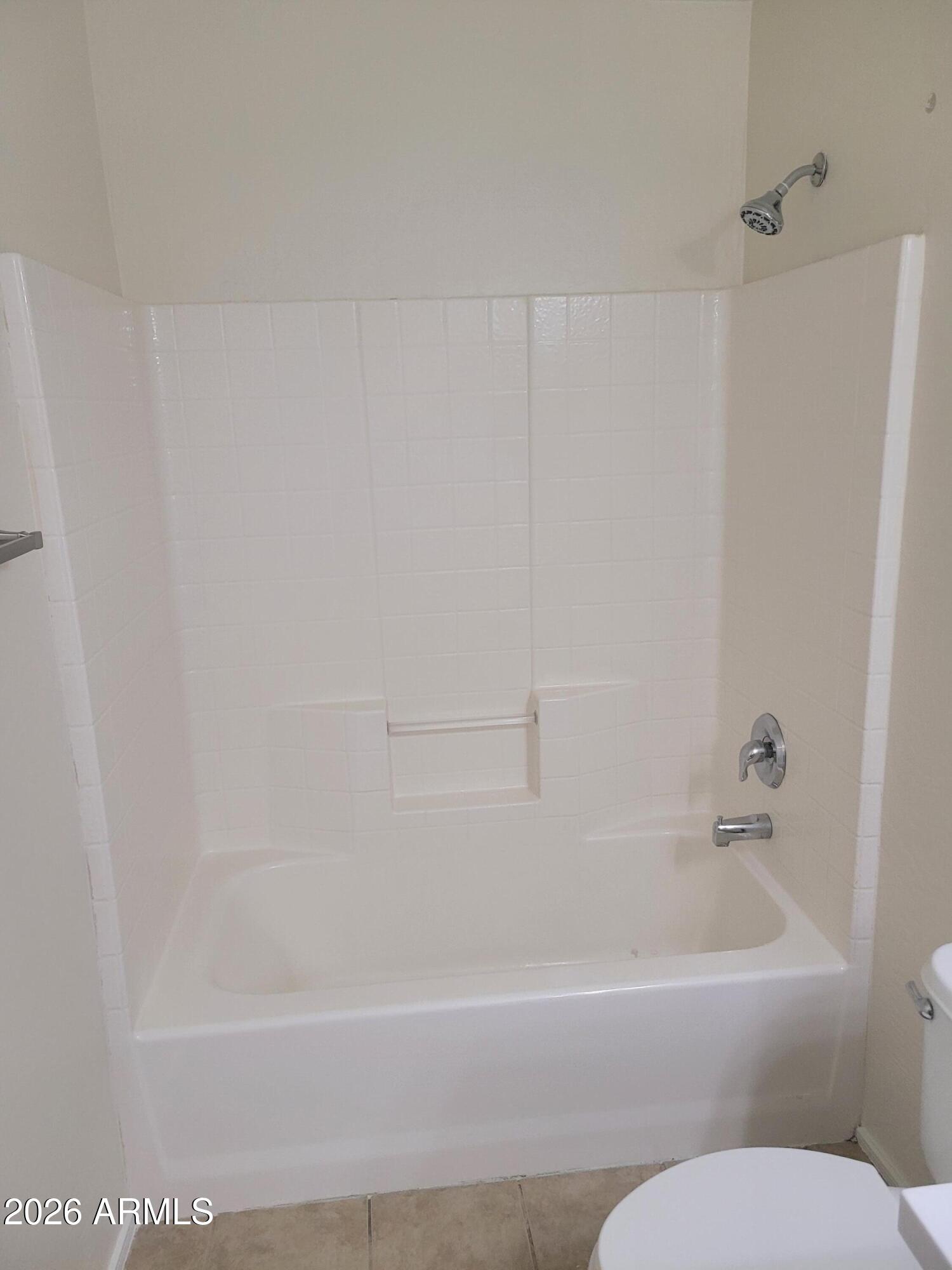 1453 South Sinova Avenue Gilbert, AZ 85296 - Photo 26 of 46 a bathroom with a bathtub and toilet