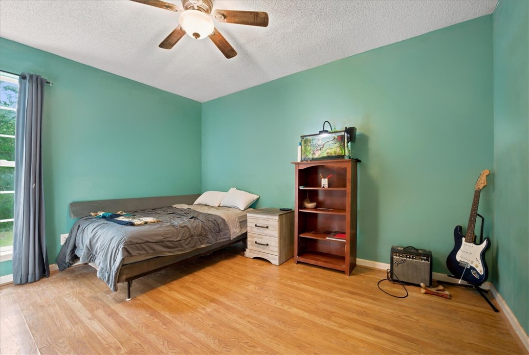 520 Sharon Lane Seneca, SC 29678 - Photo 26 of 48 Hardwood floors and a ceiling fan create a comfortable atmosphere in this well-lit room.