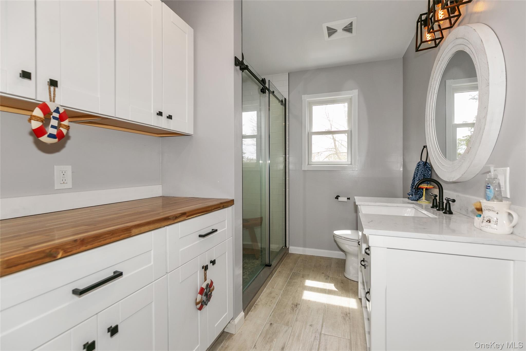 7 Suffolk Road Hampton Bays, NY 11946 - Photo 13 of 23 a view of a sink and dishwasher with washing machine