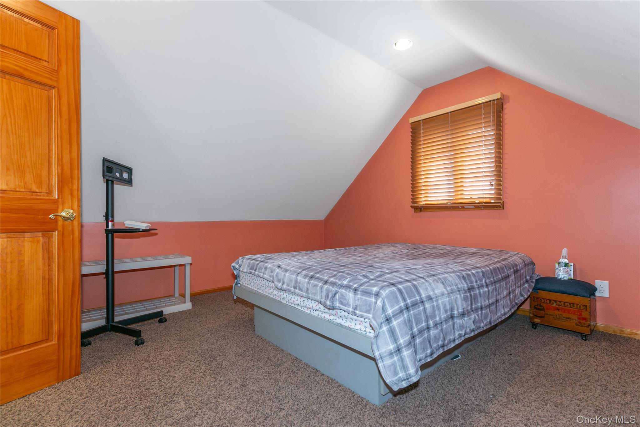 7 Suffolk Road Hampton Bays, NY 11946 - Photo 21 of 23 a bedroom with a bed and wooden floor