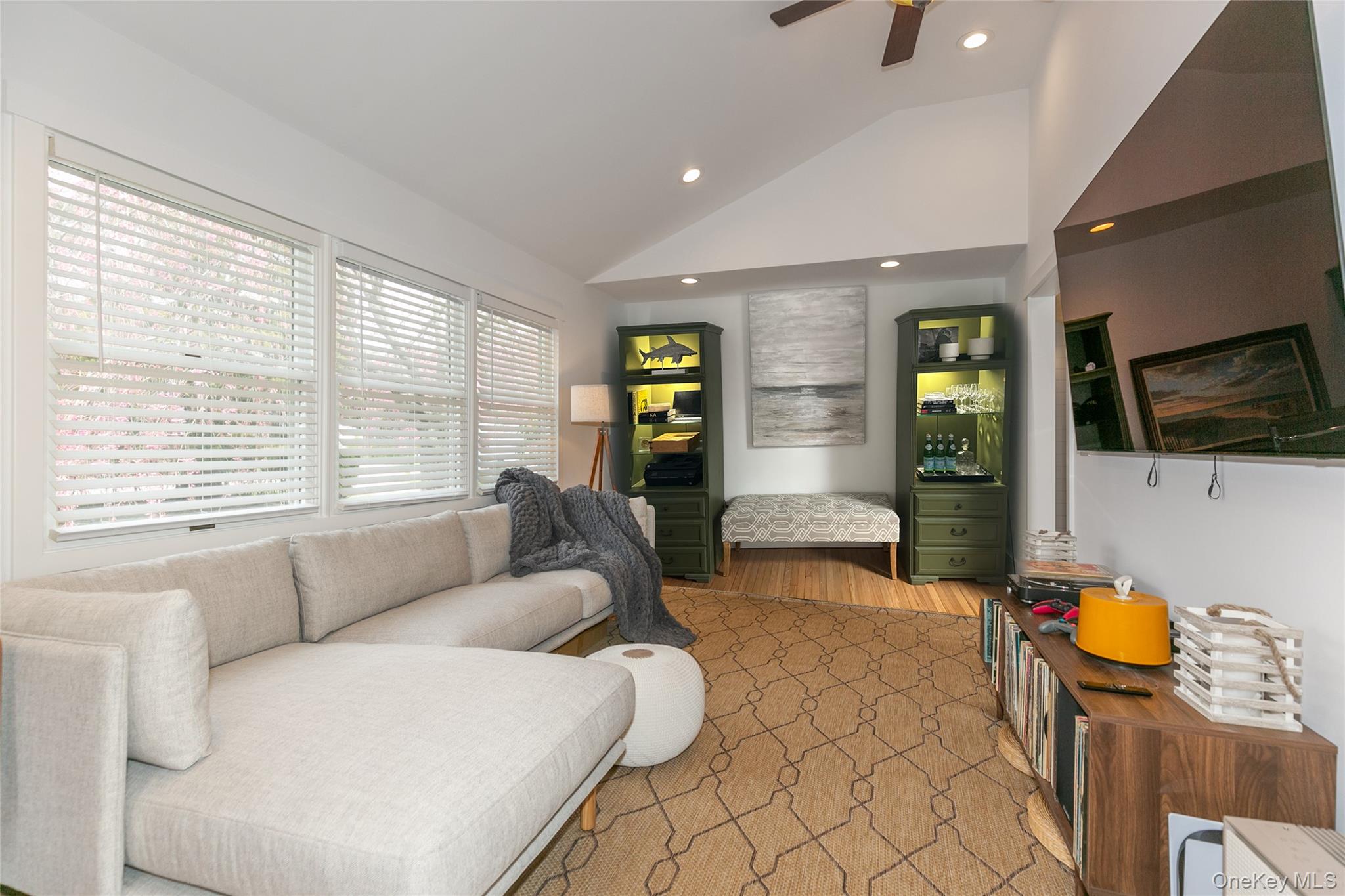 7 Suffolk Road Hampton Bays, NY 11946 - Photo 3 of 23 a living room with furniture and a flat screen tv
