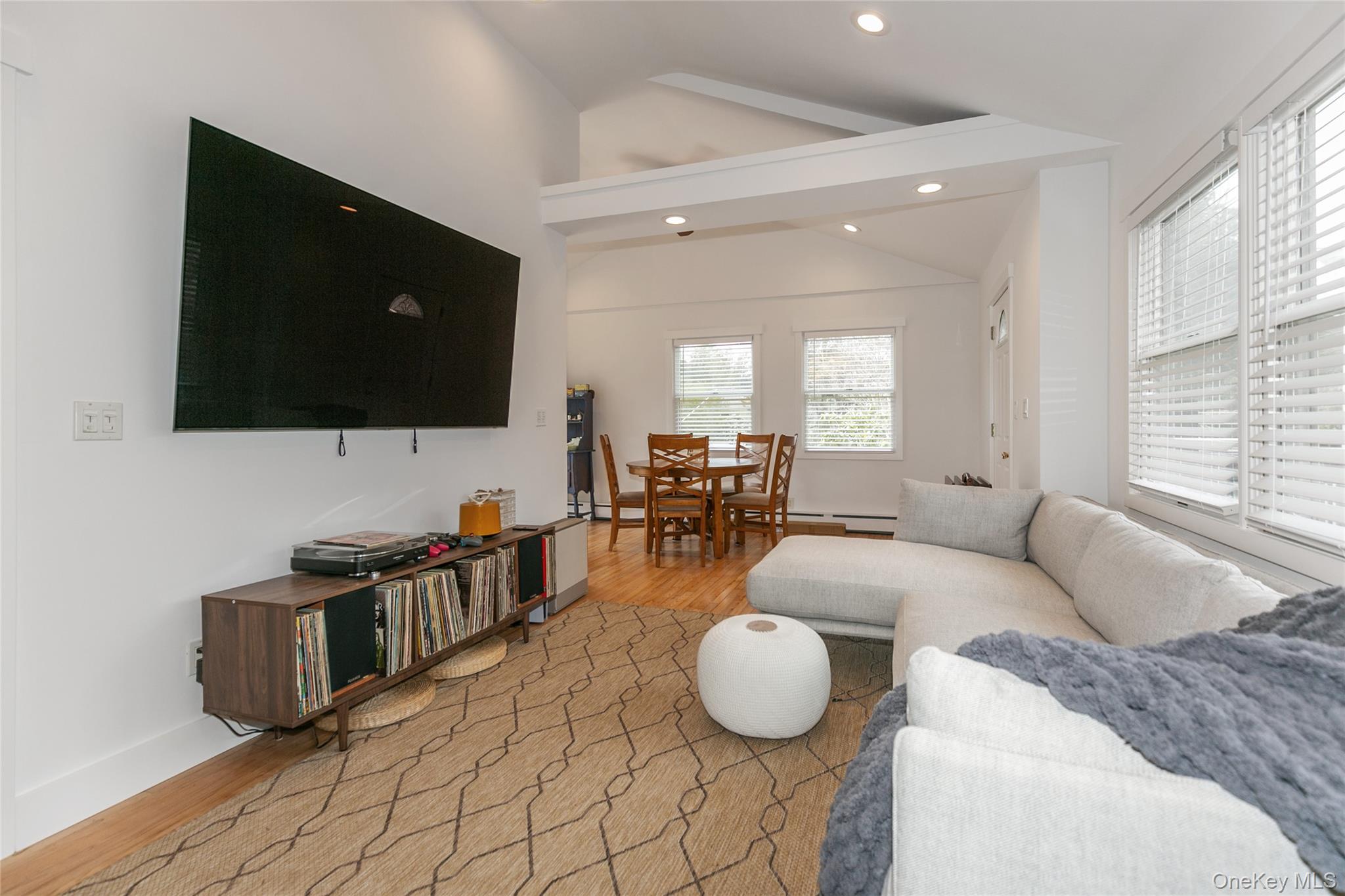7 Suffolk Road Hampton Bays, NY 11946 - Photo 4 of 23 a living room with furniture and a flat screen tv
