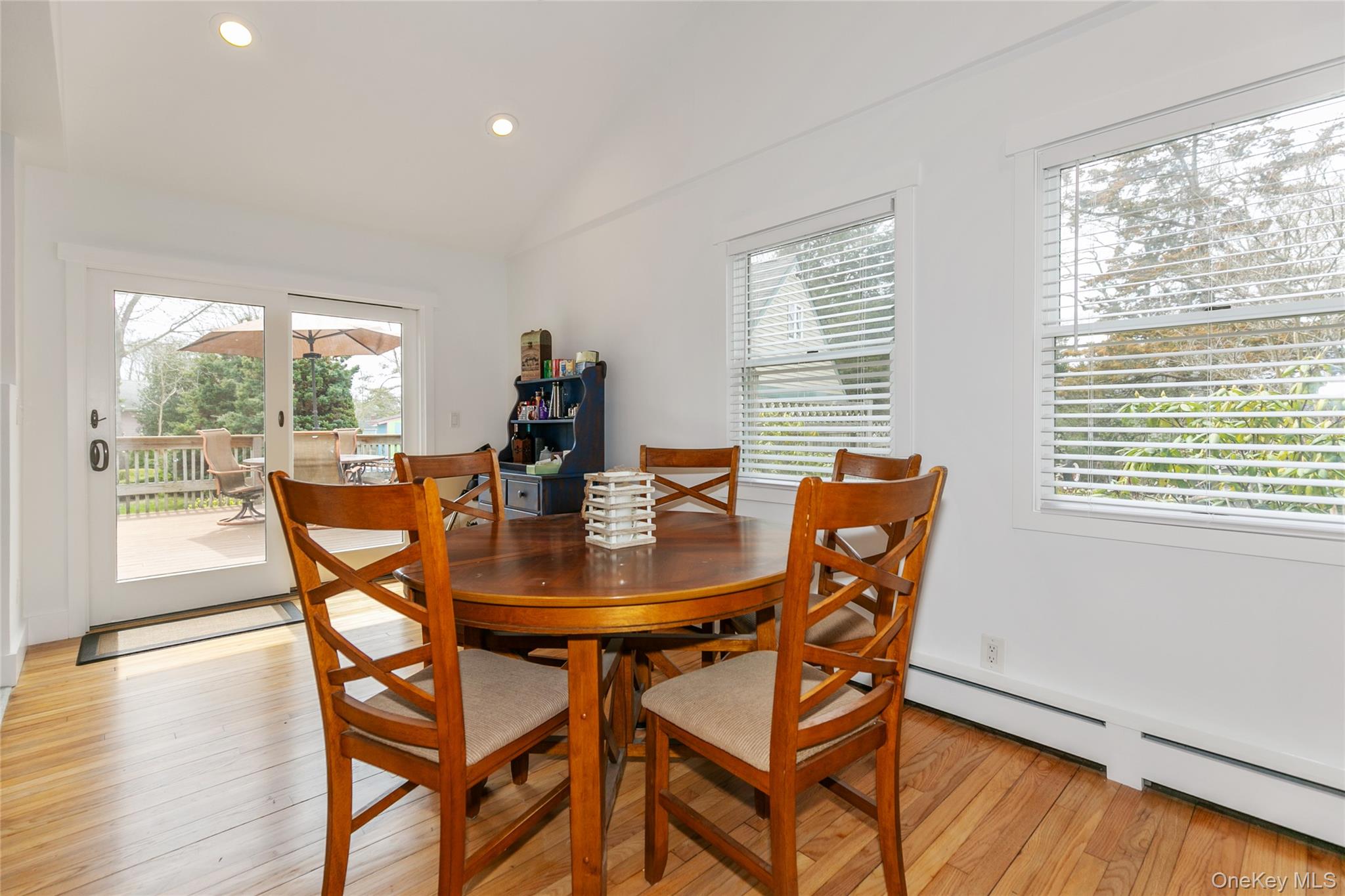 7 Suffolk Road Hampton Bays, NY 11946 - Photo 5 of 23 a dining room with furniture and wooden floor