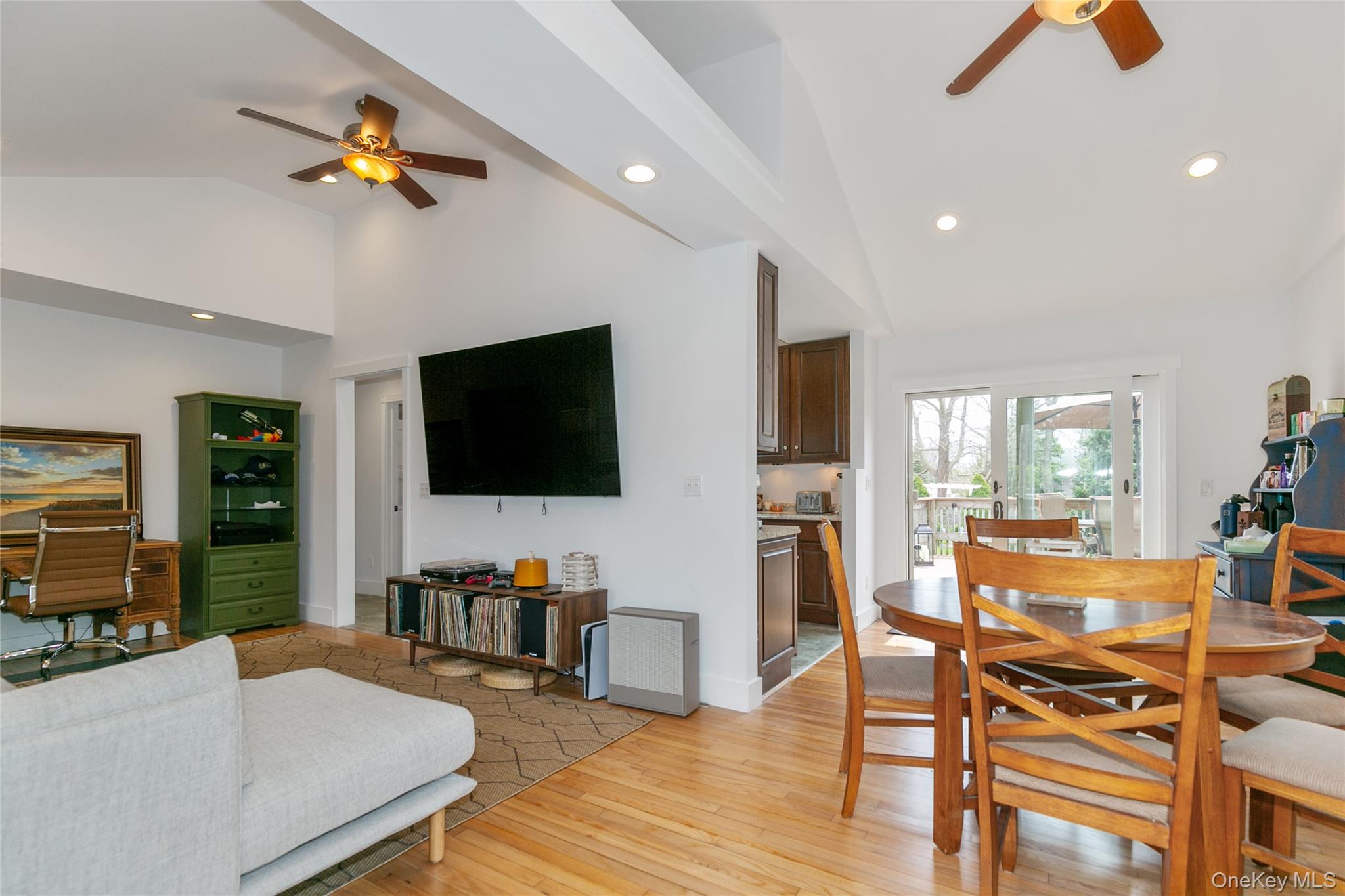 7 Suffolk Road Hampton Bays, NY 11946 - Photo 7 of 23 a living room with furniture and a flat screen tv