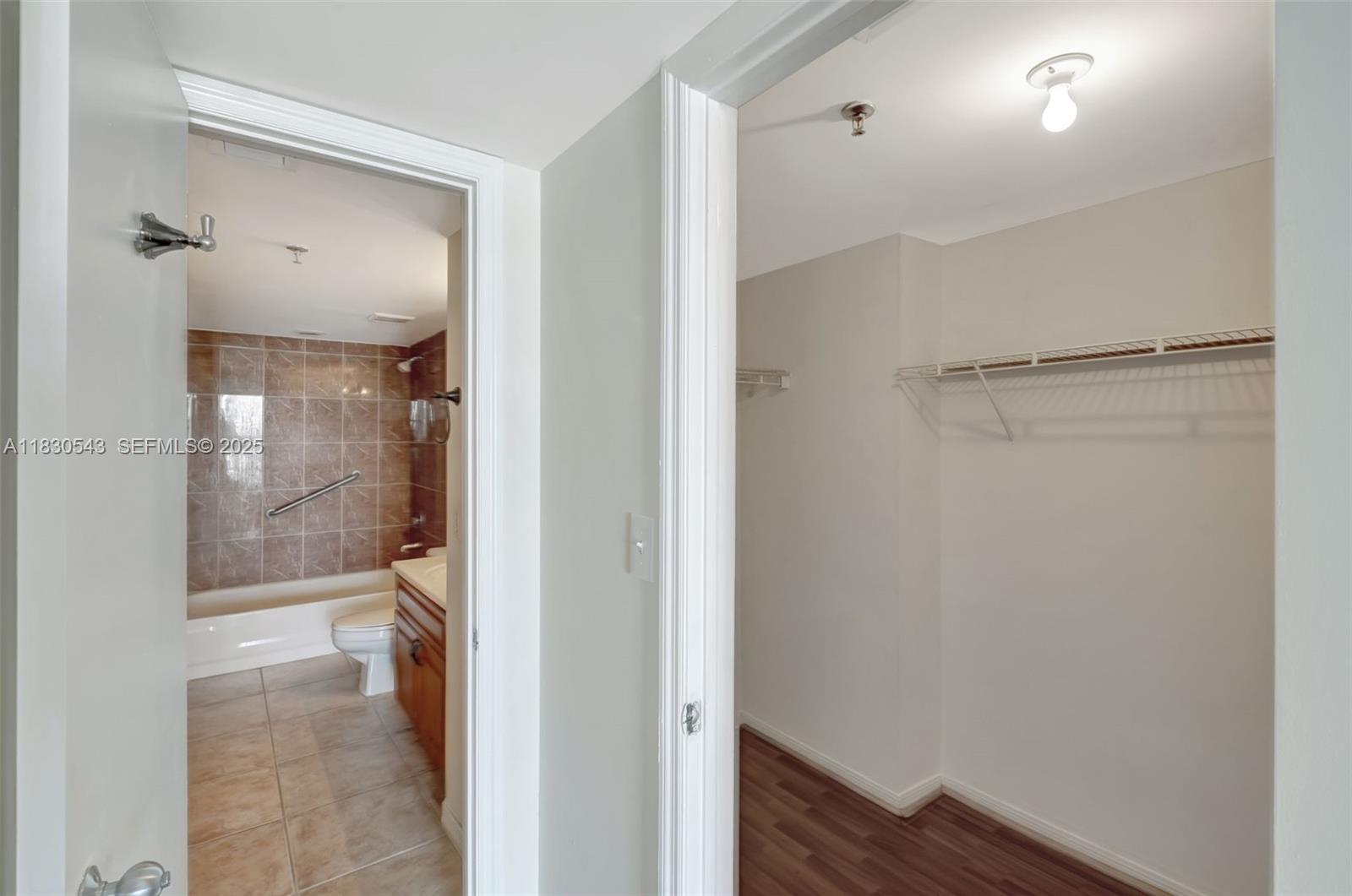 2400 Southwest 3rd Avenue, Unit 506 Miami, FL 33129 - Photo 12 of 28 a bathroom with a glass shower door