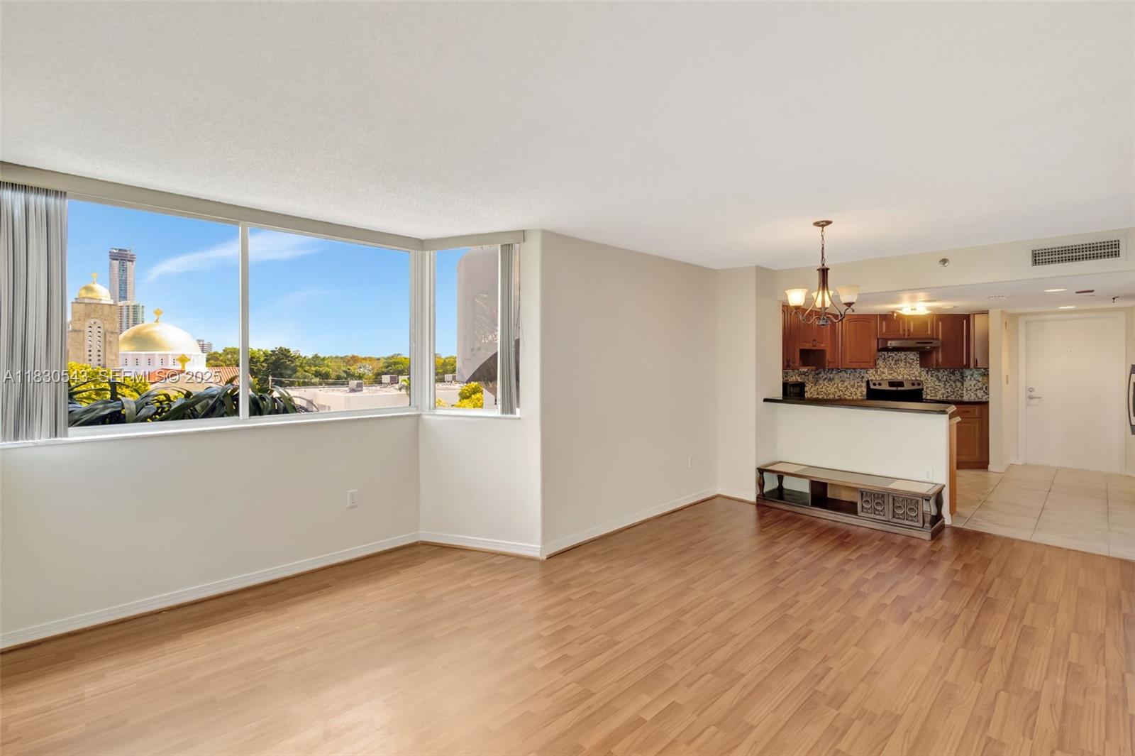 2400 Southwest 3rd Avenue, Unit 506 Miami, FL 33129 - Photo 13 of 28 a living room with stainless steel appliances kitchen island granite countertop a refrigerator and a stove top oven