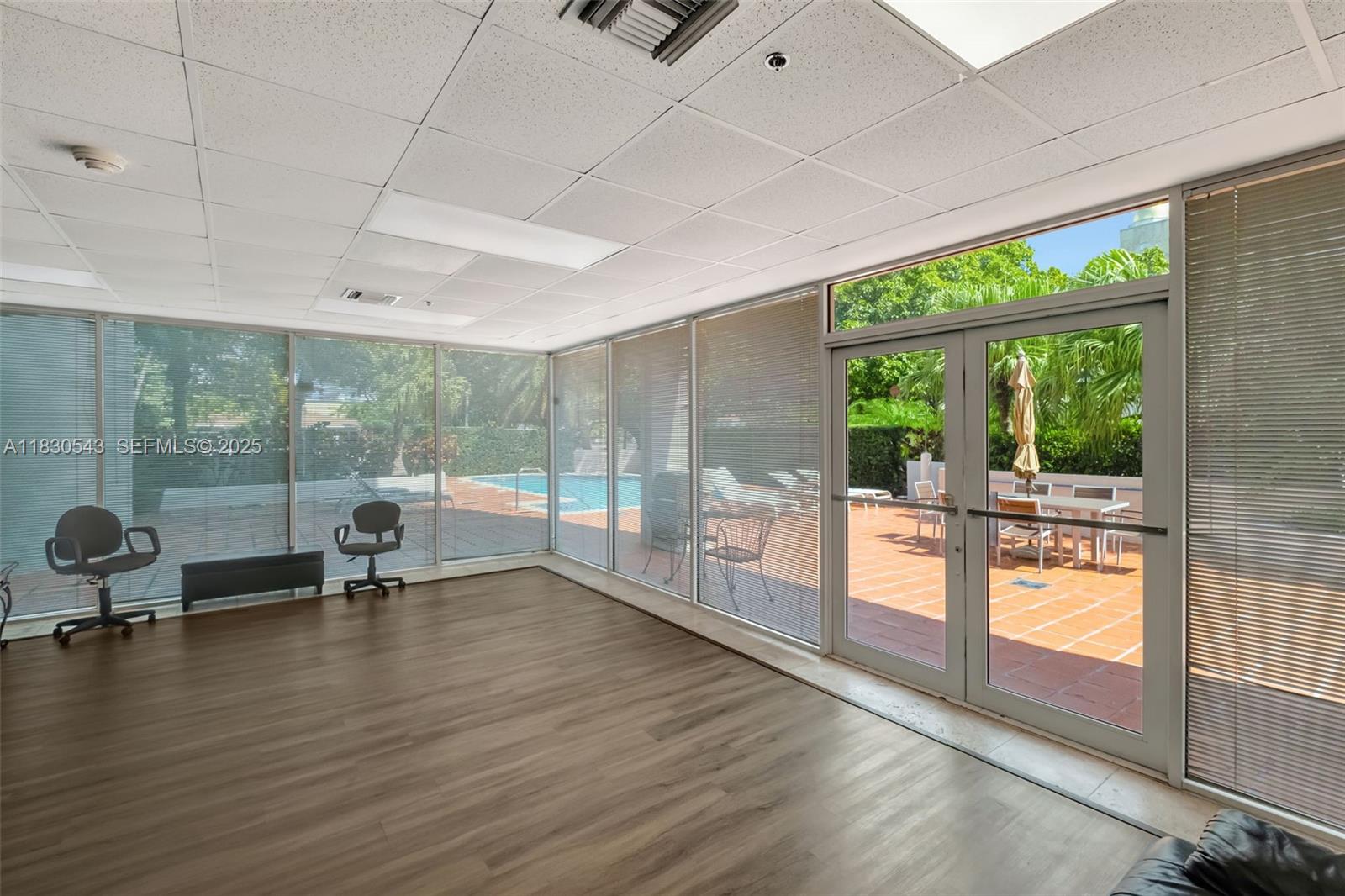 2400 Southwest 3rd Avenue, Unit 506 Miami, FL 33129 - Photo 27 of 28 a view of a room with gym equipment and floor to ceiling window