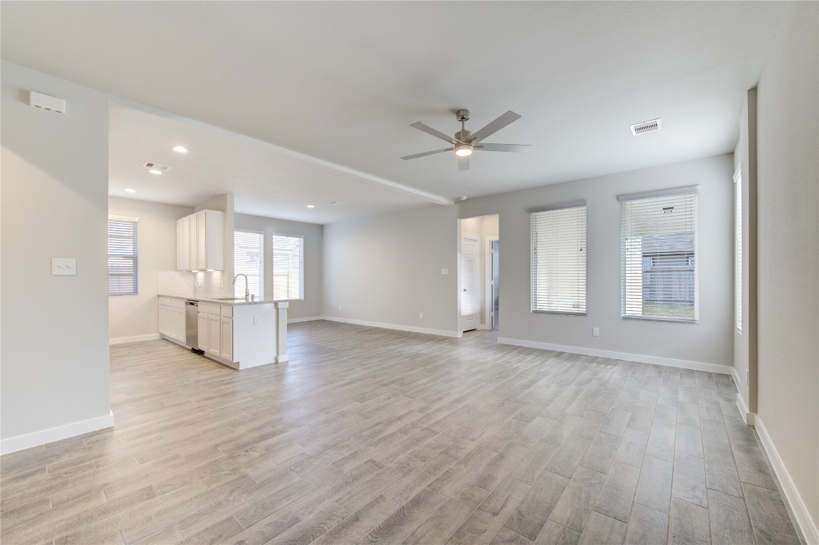 2623 Finley Lane Rosenberg, TX 77471 - Photo 4 of 49 a view of an empty room with a window and wooden floor