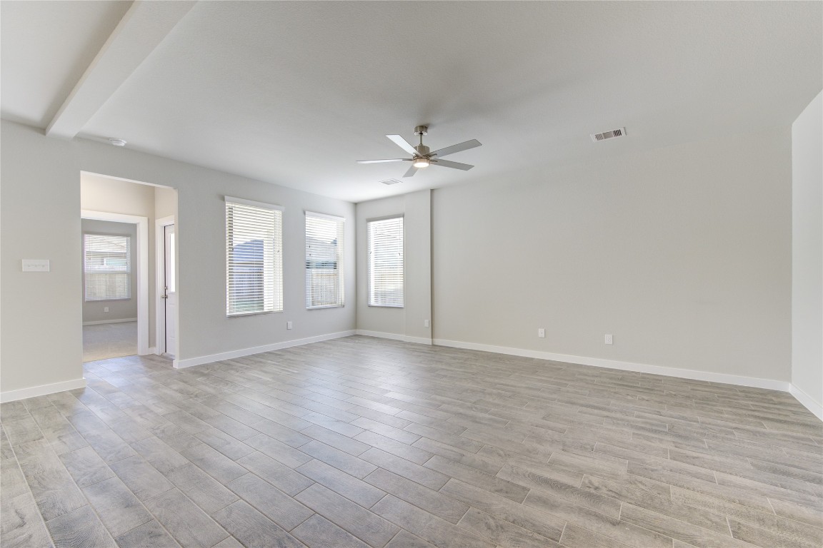 2623 Finley Lane Rosenberg, TX 77471 - Photo 9 of 49 wooden floor in an empty room with a window