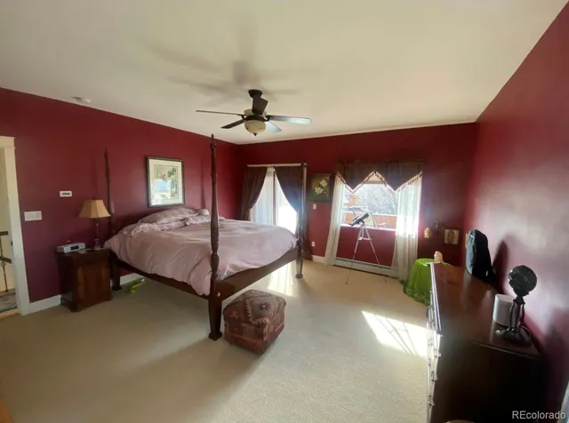 a bed room with a bed and a lamp