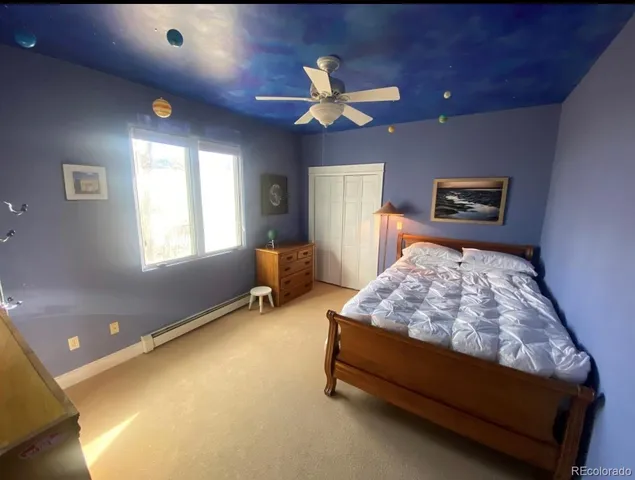 a bed room with a bed and a window