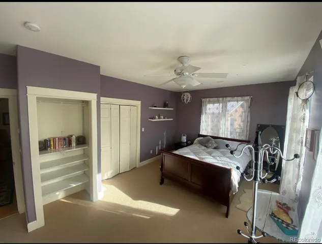 a bedroom with furniture and window