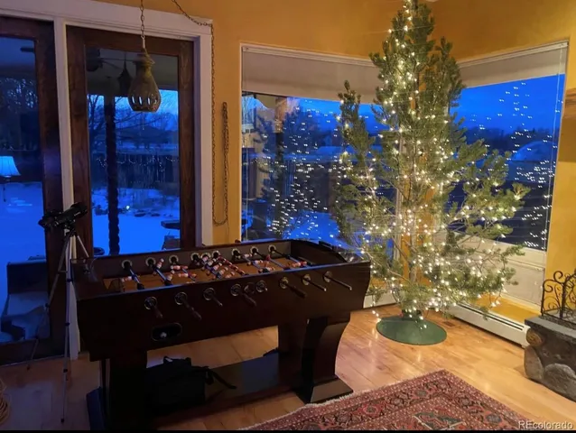 a room with red door and glass table