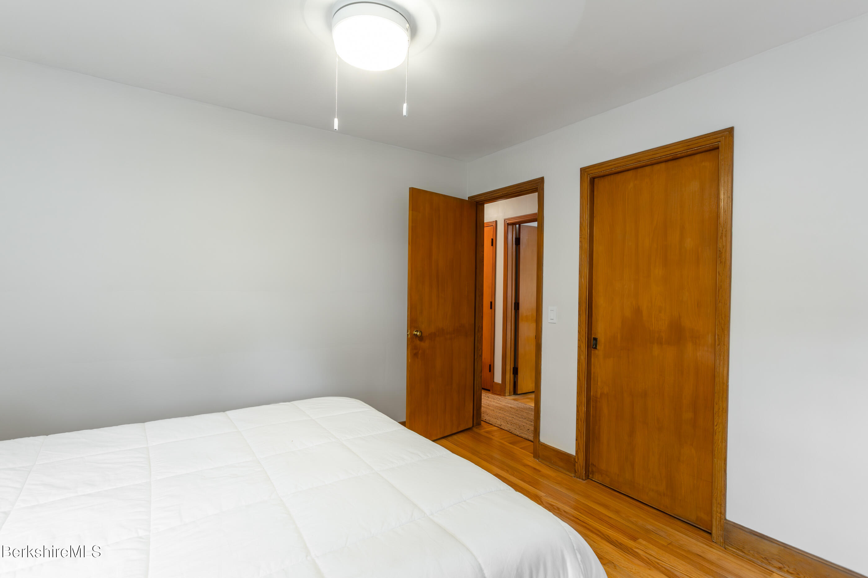 139 Gamwell Avenue Pittsfield, MA 01201 - Photo 16 of 33 a bedroom with a bed and a mirror