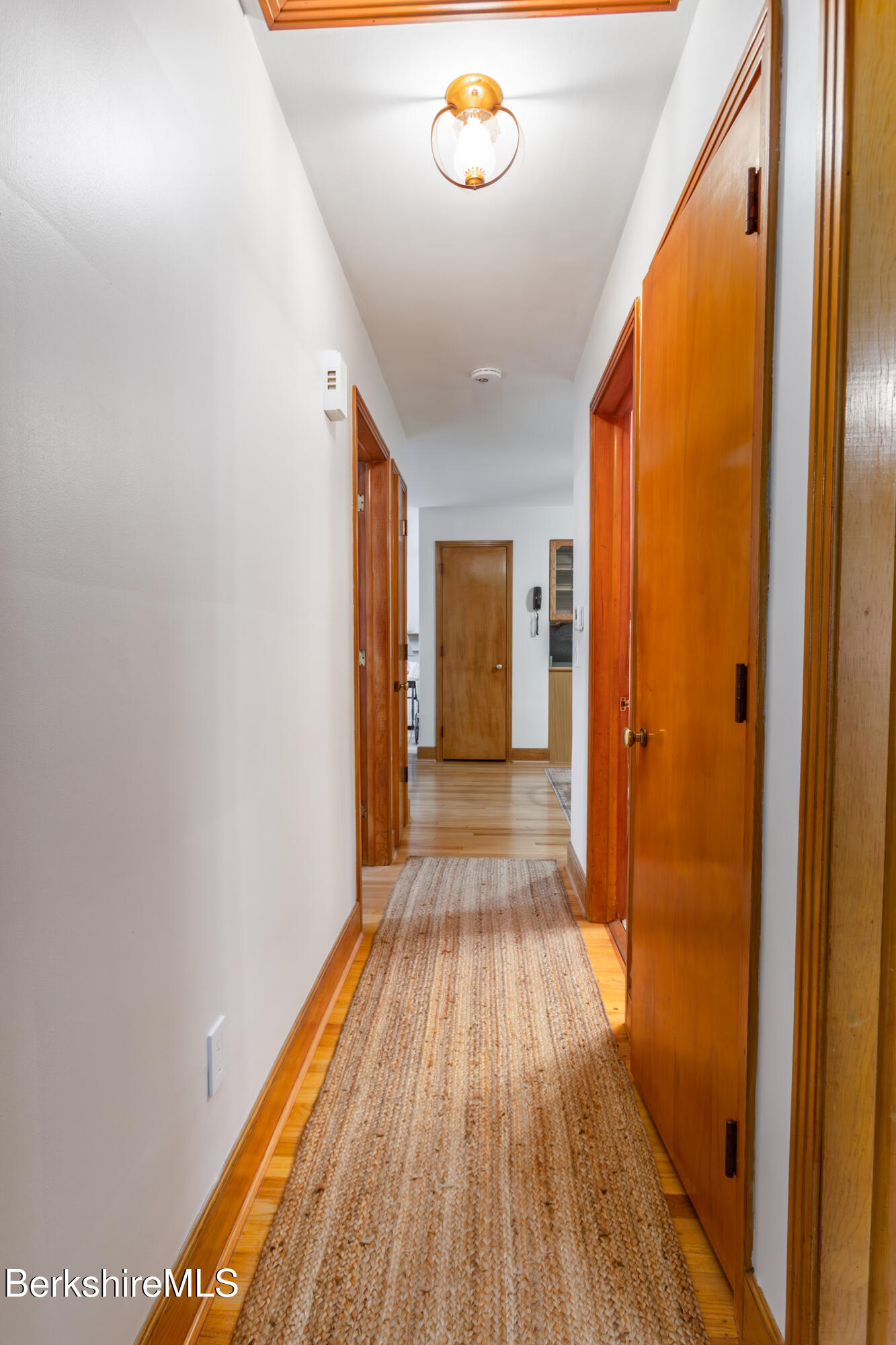 139 Gamwell Avenue Pittsfield, MA 01201 - Photo 17 of 33 a view of a hallway with wooden floor