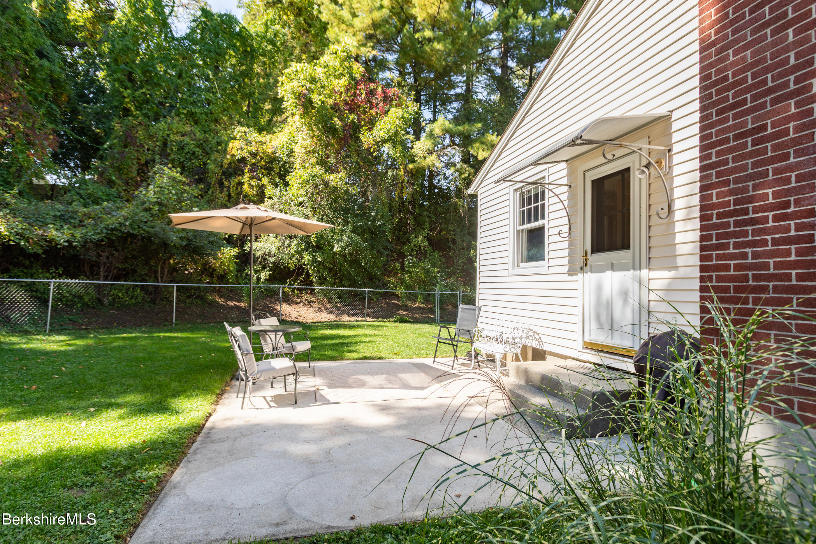 139 Gamwell Avenue Pittsfield, MA 01201 - Photo 25 of 33 a view of a chair and table in the backyard