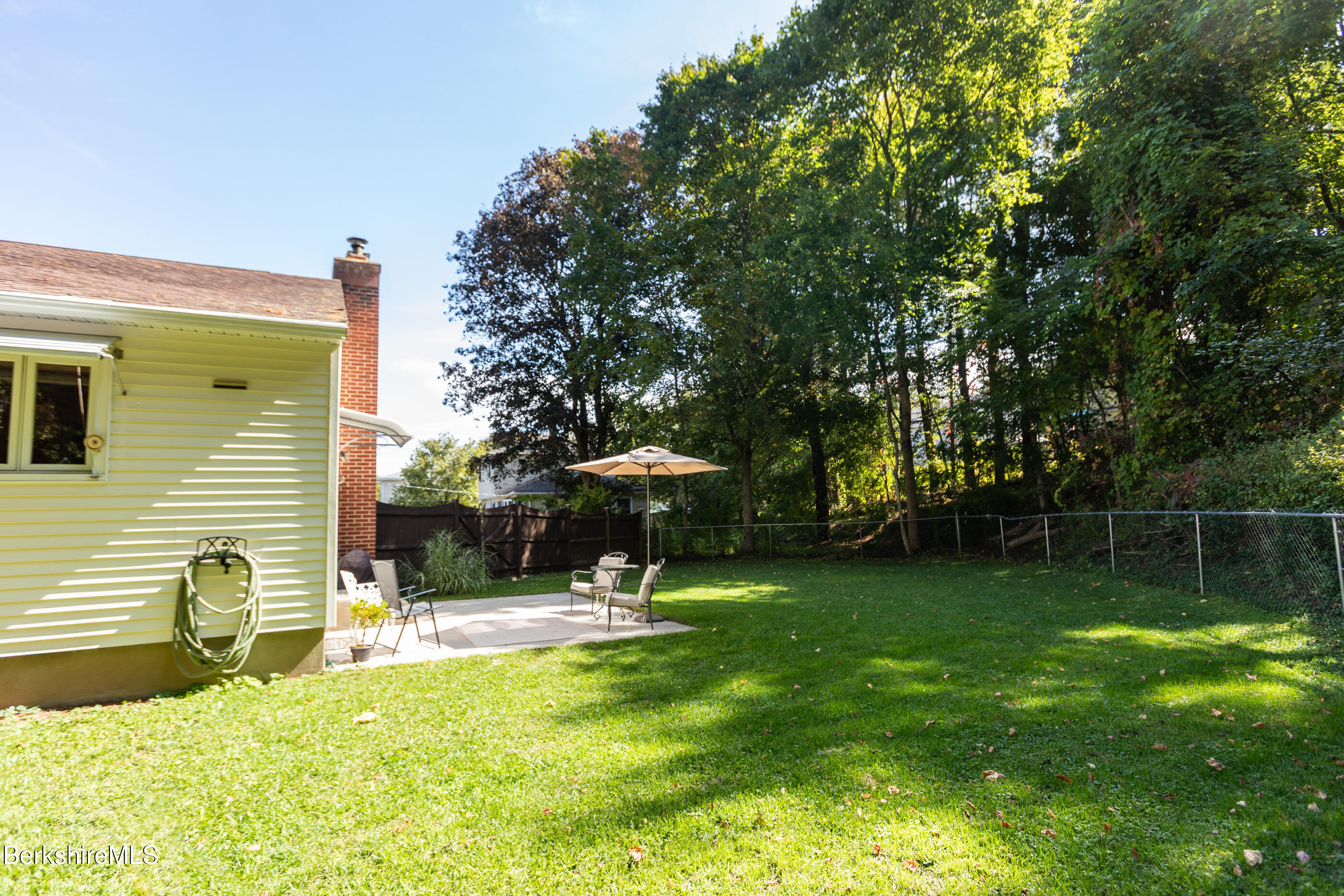 139 Gamwell Avenue Pittsfield, MA 01201 - Photo 27 of 33 a swimming pool with outdoor seating and yard