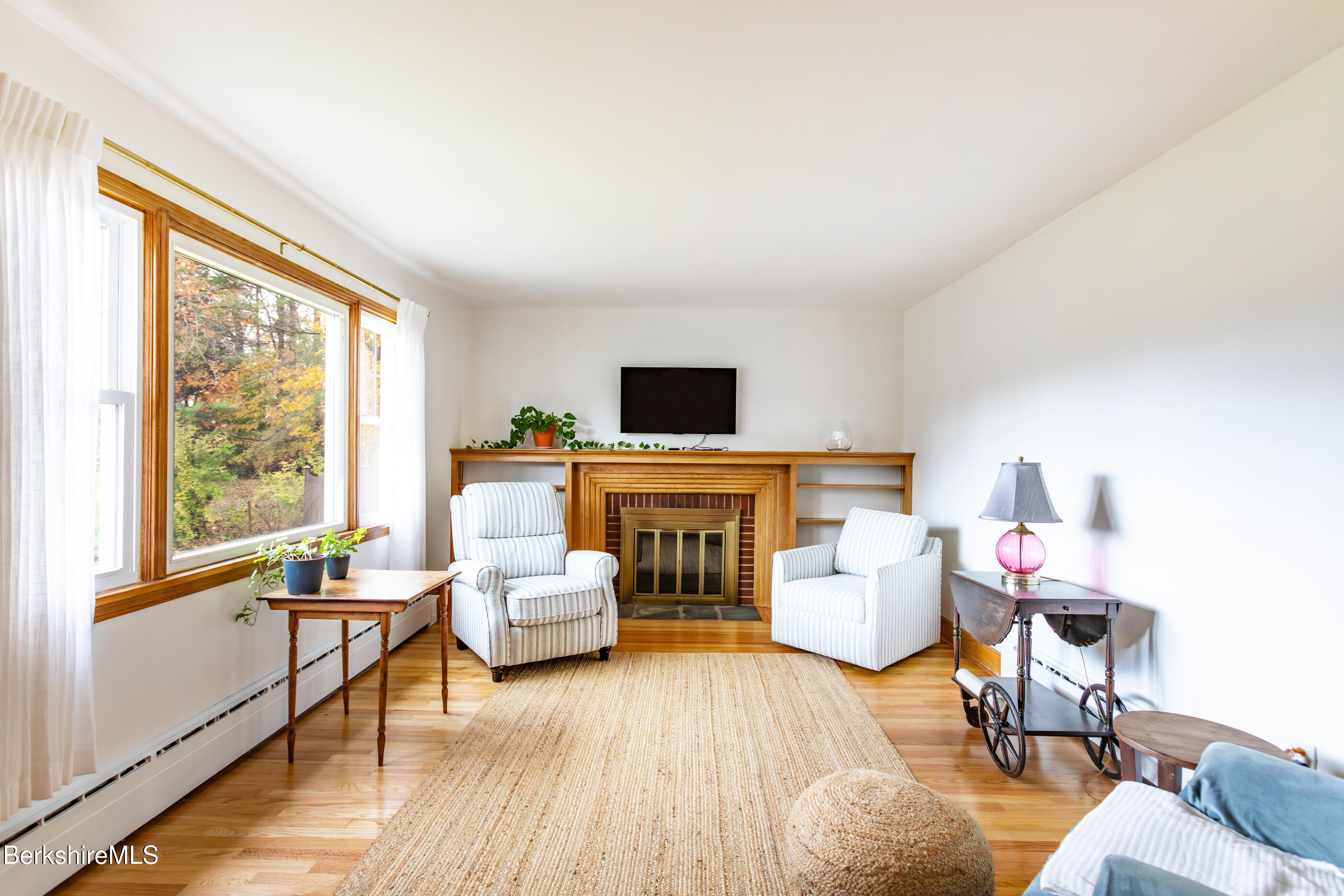 139 Gamwell Avenue Pittsfield, MA 01201 - Photo 4 of 33 a living room with furniture and a flat screen tv