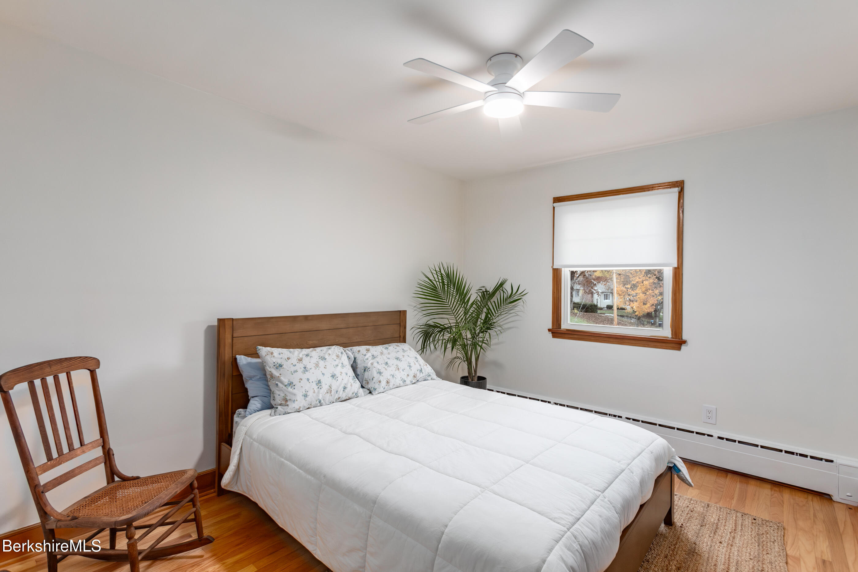 139 Gamwell Avenue Pittsfield, MA 01201 - Photo 10 of 33 a bedroom with a large bed and a chandelier
