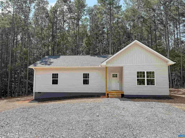 a view of house with a yard and garage