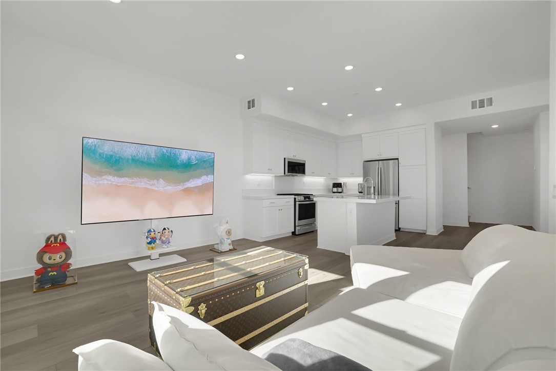 1958 Hollyleaf Terrace Montebello, CA 90640 - Photo 11 of 58 a living room with furniture and a flat screen tv